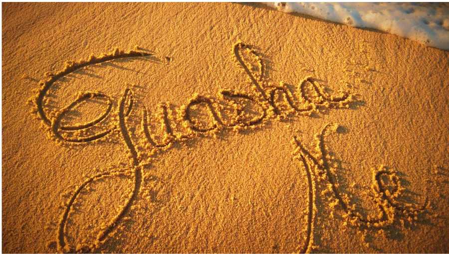 Logo GuashaMe inscrit dans le sable